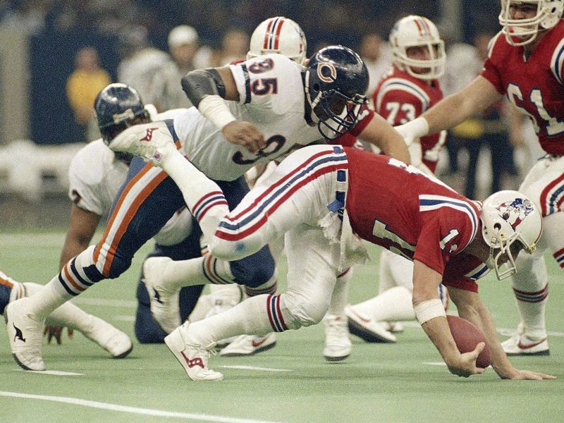Chicago Bears defensive end Richard Dent sacks New England Patriots quarterback Steve Grogan in Super Bowl XX