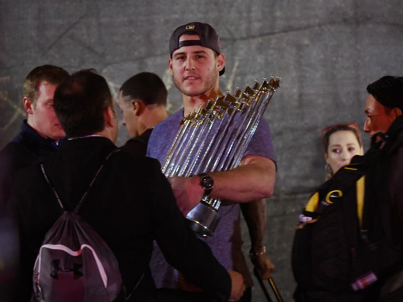 Chicago Cubs first baseman Anthony Rizzo displays Commissioner's Trophy