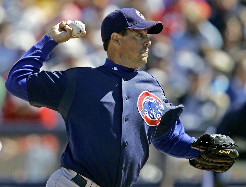 Chicago Cubs starter Greg Maddux throws pitch