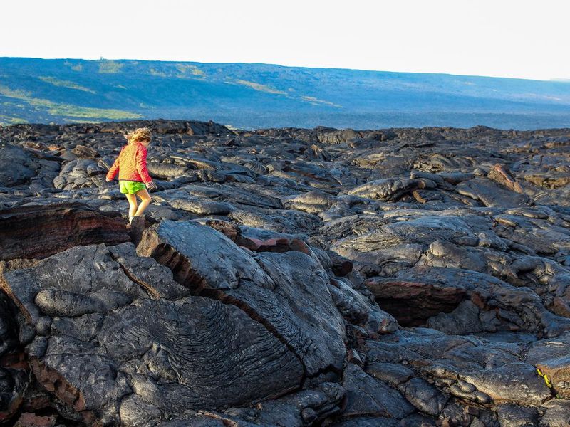 Child explores Volcano Field, Volcano national park