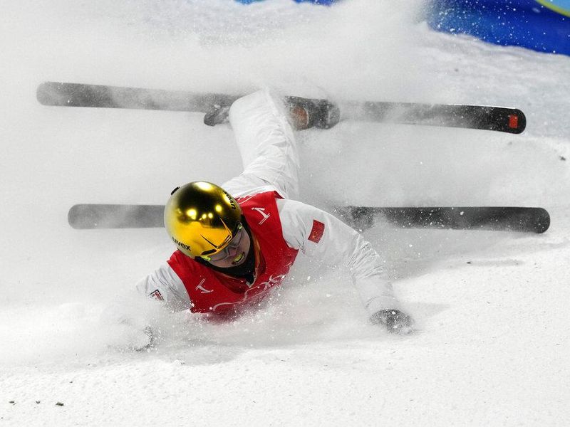 China's Qi Guangpu skis in olympic highlight