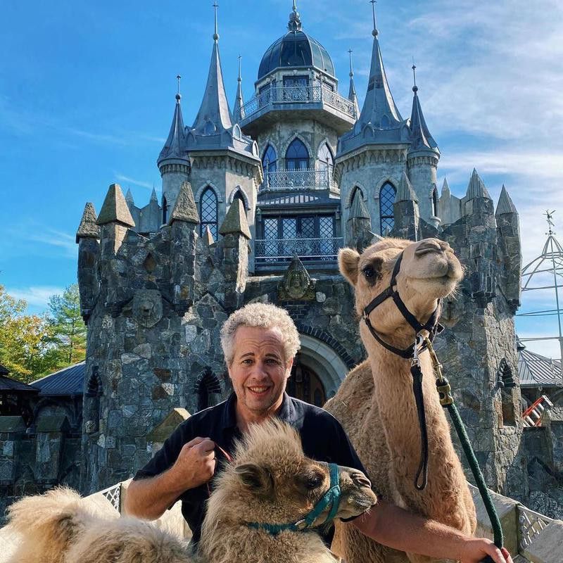 Chris Mark with his camels in his castle