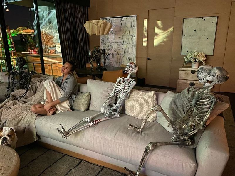 Chrissy Teigen with some skeletons