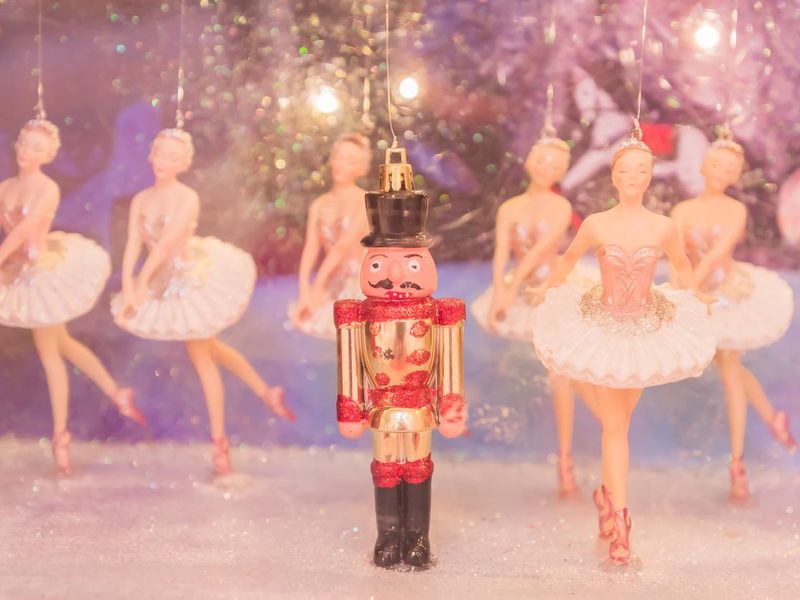 Christmas nutcracker toy soldier and balerina dolls on the stage. Famous Russian Ballet installation.