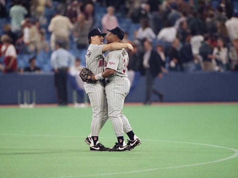 Chuck Knoblauch and Kirby Puckett celebrate after a Twins win