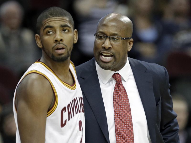 Cleveland Cavaliers head coach Mike Brown talks to Kyrie Irving