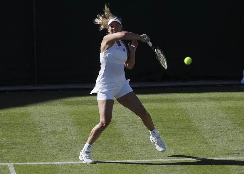 Coco Vandeweghe returns ball during Wimbledon Tennis Championships
