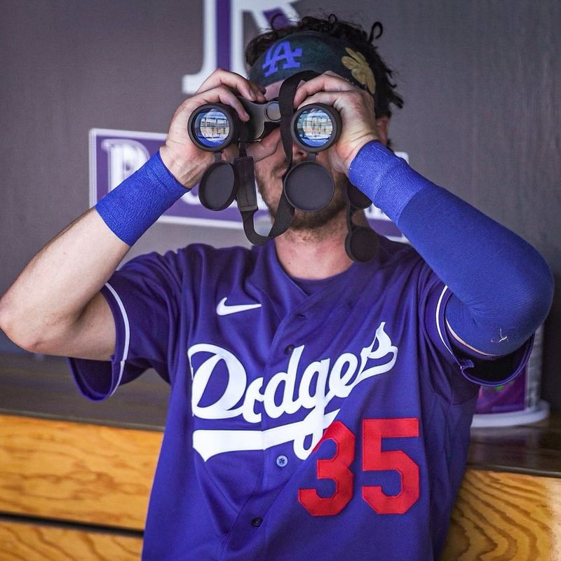 Cody Bellinger looking through binoculars