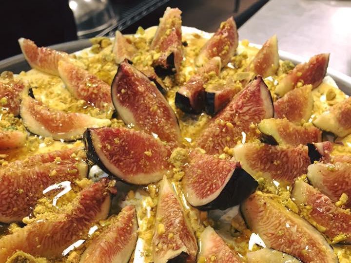 Coffee cake with mascarpone frosting topped with figs, pistachios and a honey drizzle at Leyla Fine Lebanese Cuisine in Charleston