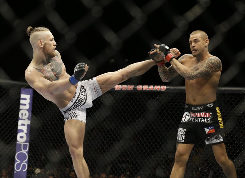 Conor McGregor kicks Dustin Poirier during mixed martial arts