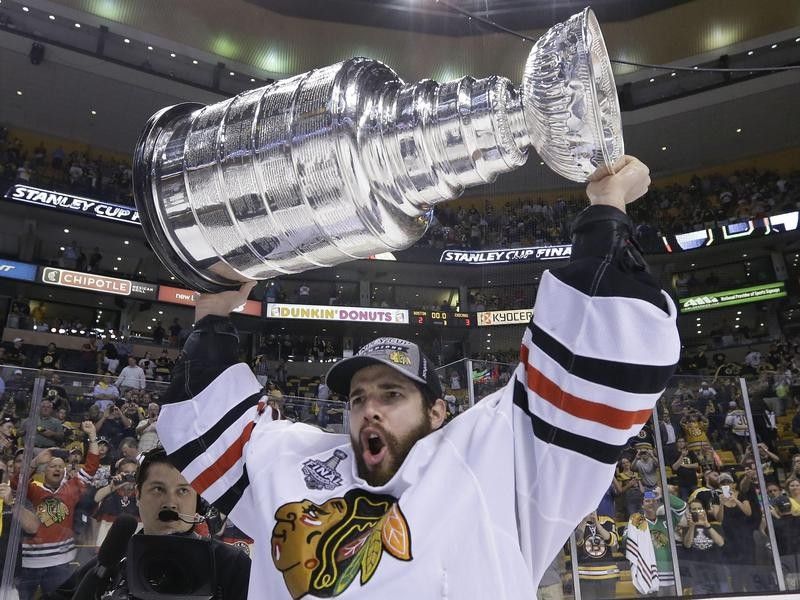 Corey Crawford of the Chicago Blackhawks celebrates with Stanley Cup
