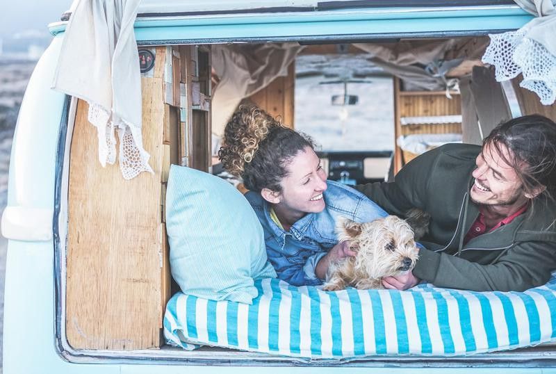 Couple and dog in van