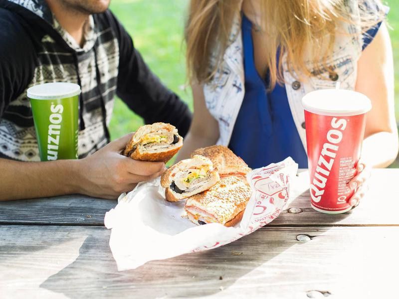Couple eating Quiznos
