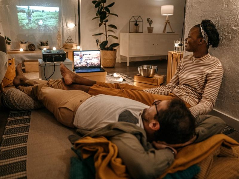 Couple watching movie in home theatre