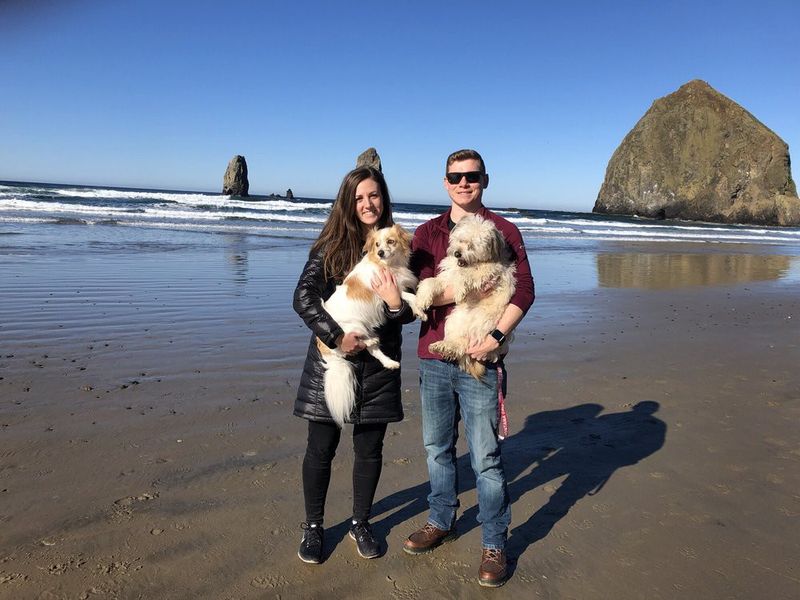 Couple with their dogs at Cannon Beach