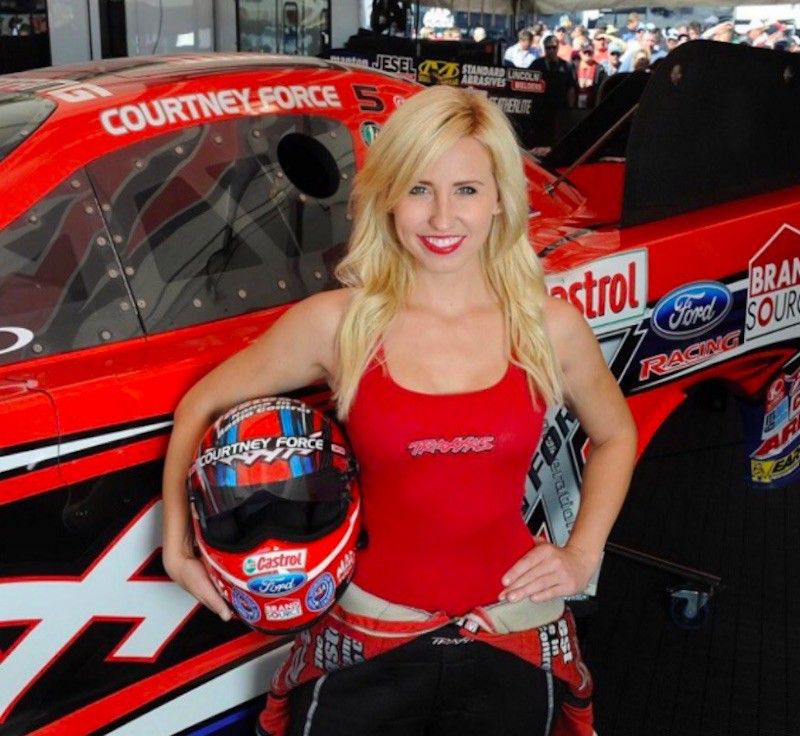Courtney Force poses with helmet