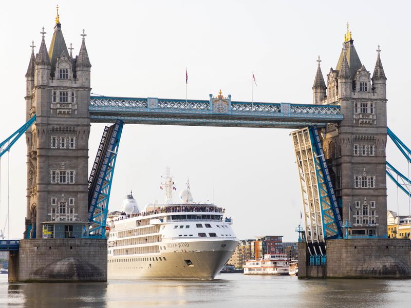 Cruise ship Silver Wind, part of the Silversea Cruises fleet, passes Tower Bridge on her journey down the Thames