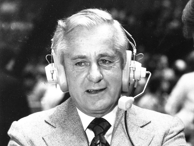 Curt Gowdy with headset on
