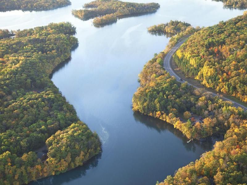 Curving road along Mississippi River during autumn