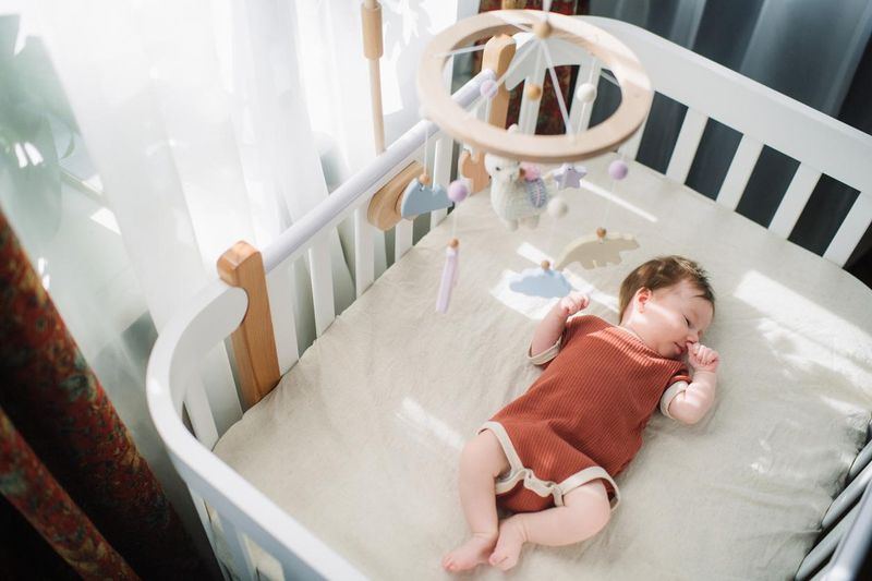 Cute baby girl in her crib