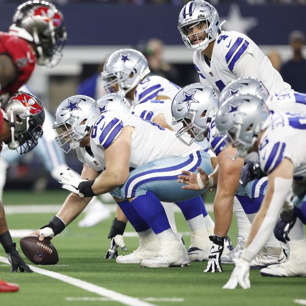 Dallas Cowboys quarterback Dak Prescott (4) lines up for the snap under center Tyler Biadasz (63) at the line of scrimmage during an NFL football game against the Tampa Bay Buccaneers on Sunday, September 11, 2022, in Arlington, Texas. (AP Photo/Matt Patterson)