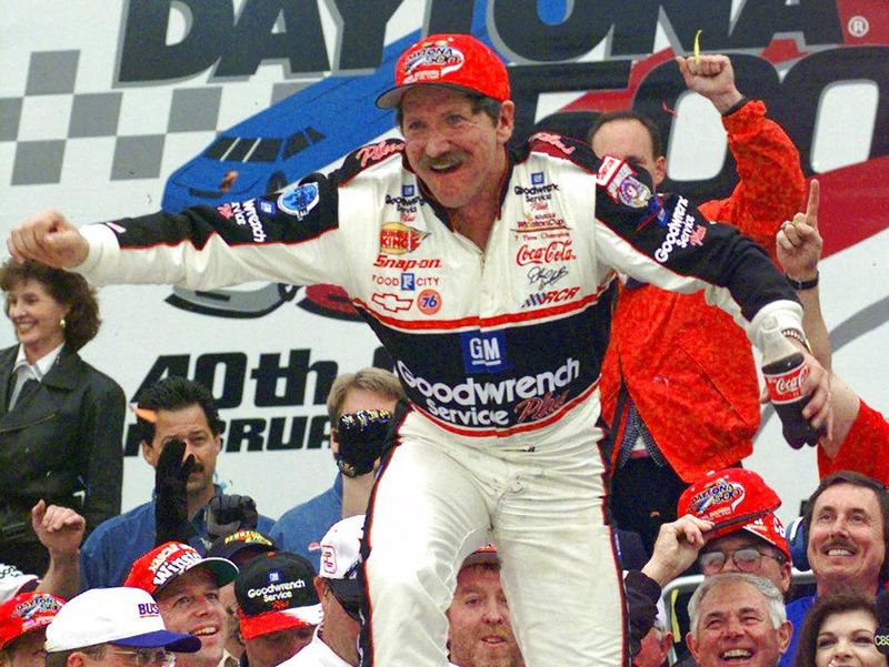 Dale Earnhardt celebrating after winning Daytona 500 in 1998
