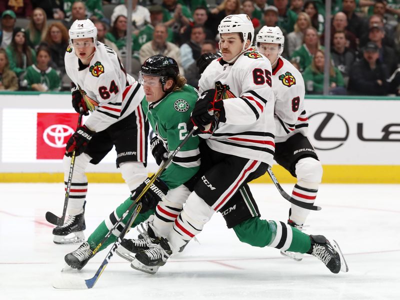 Dallas Stars Roope Hintz and Chicago Blackhawks center Andrew Shaw collide