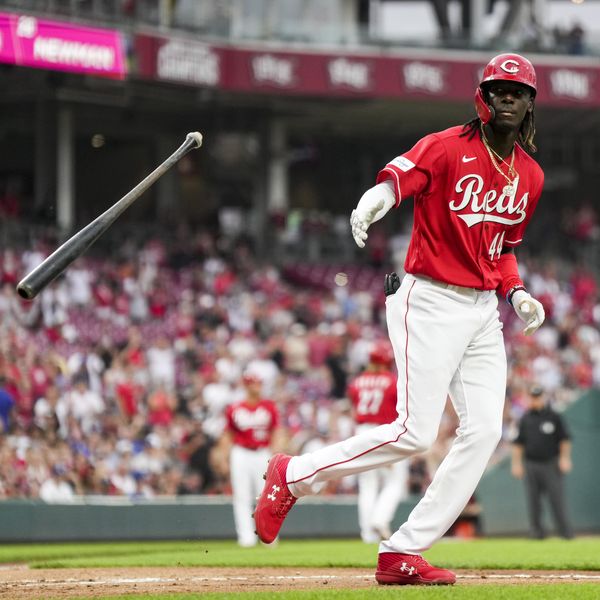 Cincinnati Reds' Elly De La Cruz tosses his bat after drawing a walk during the first inning of the team's baseball game against the Los Angeles Dodgers in Cincinnati, Tuesday, June 6, 2023. (AP Photo/Aaron Doster)