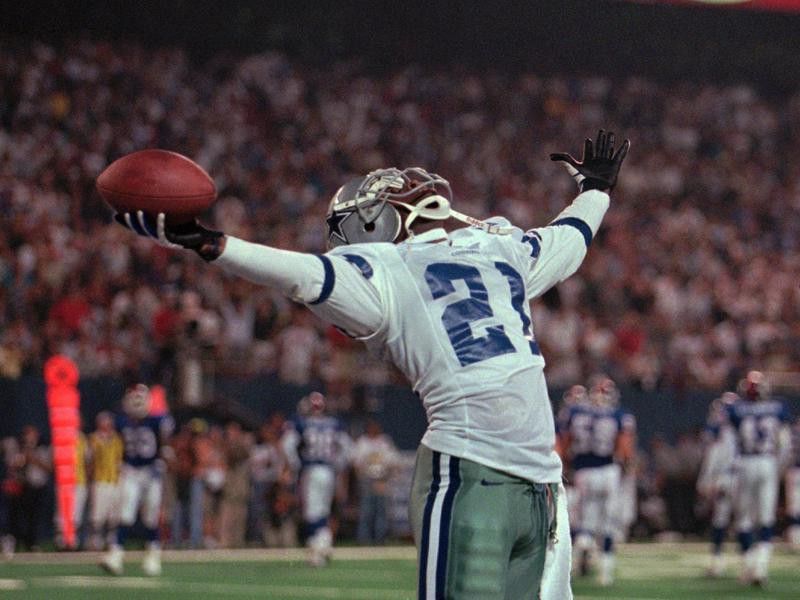 Deion Sanders of the Dallas Cowboys holds for applause from the crowd