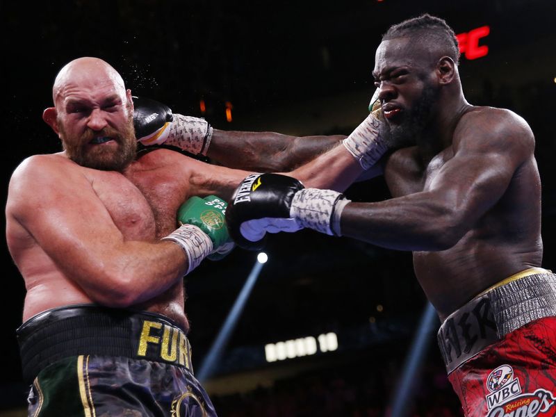 Deontay Wilder and Tyson Fury trade blows