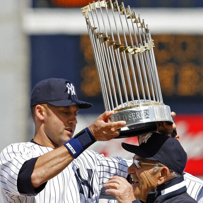 Derek Jeter lifts trophy over Yogi Berra's head