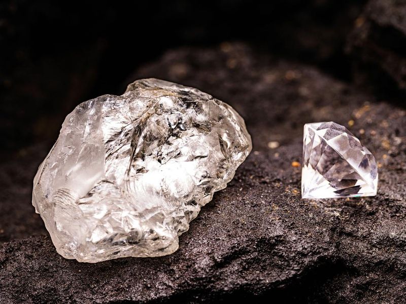 Diamond cut in rough diamond in coal mine, concept of rare stone being mined, mineral wealth