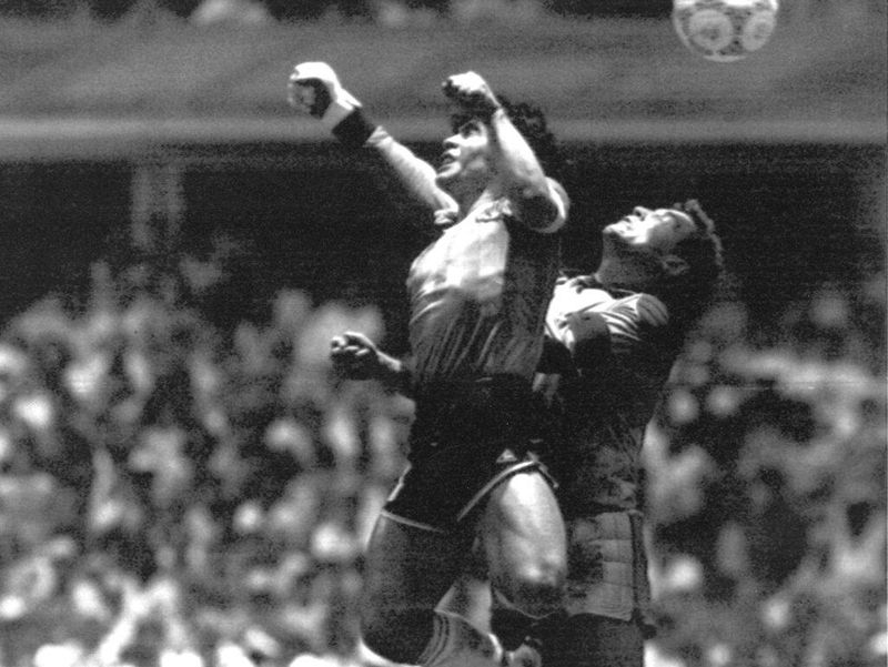 Diego Maradona scores a goal at the World Cup