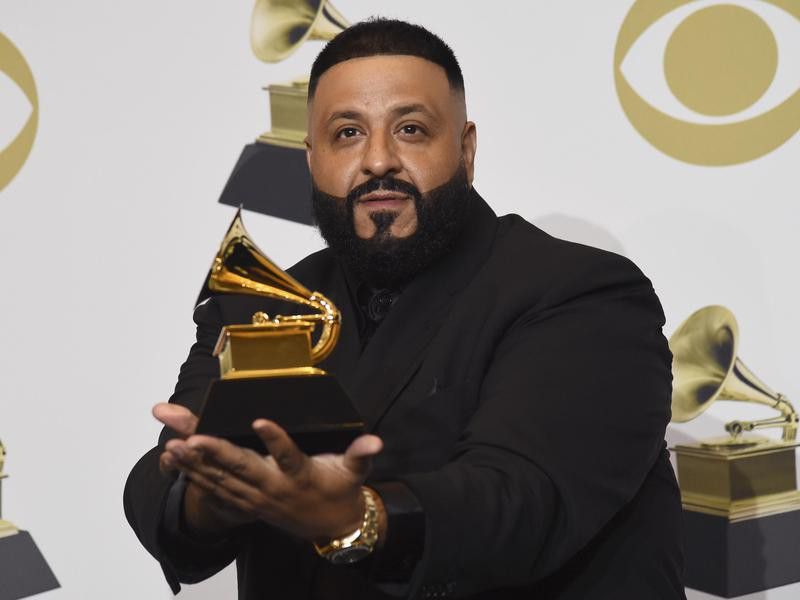 DJ Khaled poses in the press room with a Grammy