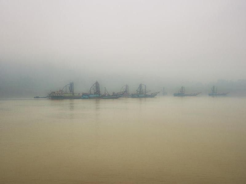 Dredgers on the Yangtze River with heavy air pollution