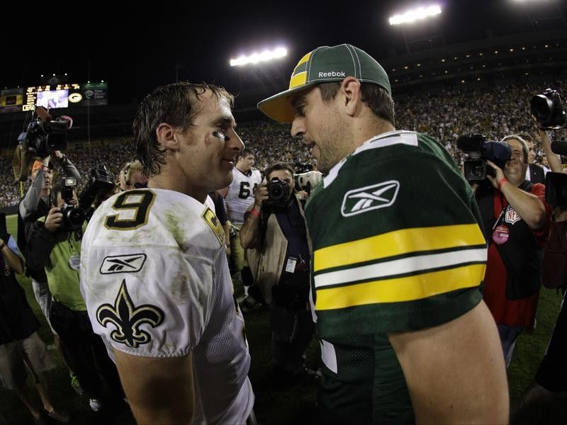 Drew Brees and Aaron Rodgers talk after a game