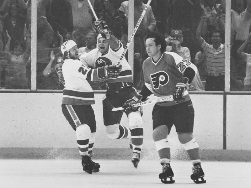 Duane Sutter celebrates with Butch Goring