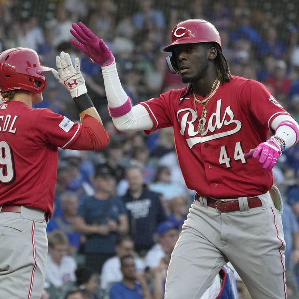 Cincinnati Reds' Elly De La Cruz, right, celebrates with TJ Friedl after hitting a solo home run against the Chicago Cubs during the first inning of a baseball game in Chicago, Thursday, Aug. 3, 2023. (AP Photo/Nam Y. Huh)