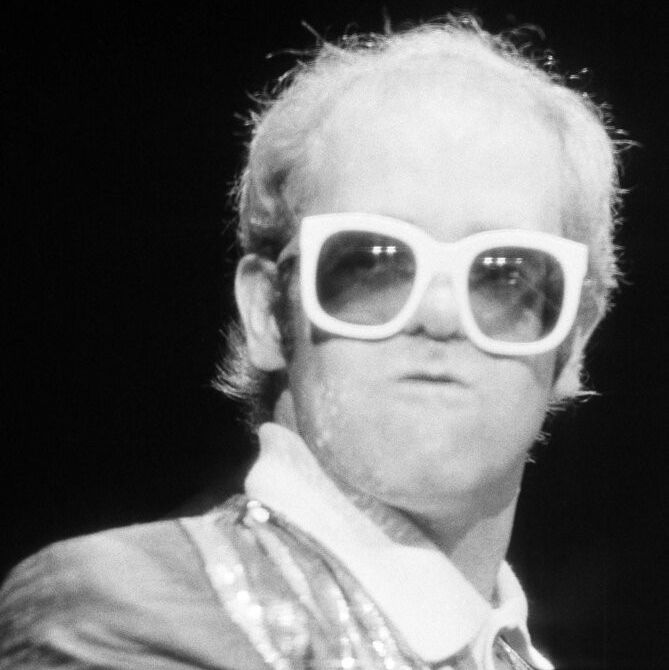 Elton John performs at the piano at New York's Madison Square Garden, August 10, 1976. (AP Photo)