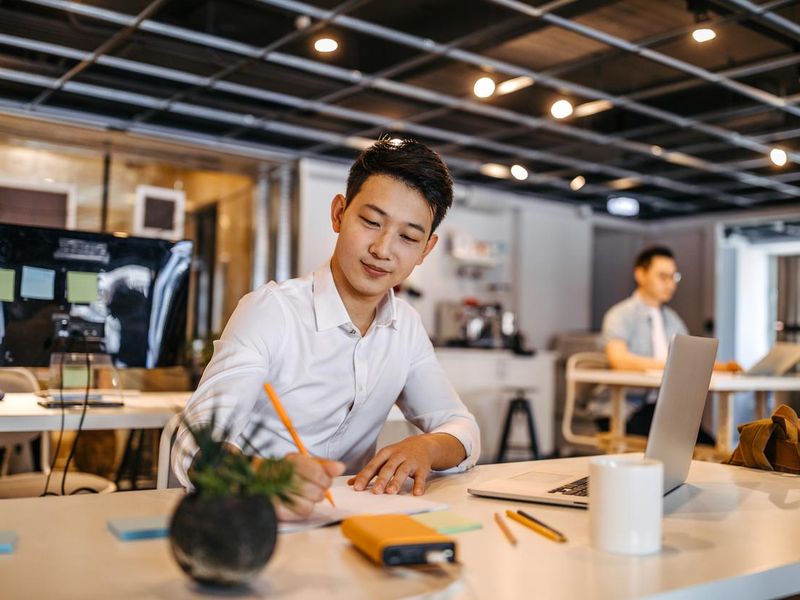 Entrepreneur sitting in modern office space in Taipei, Taiwan