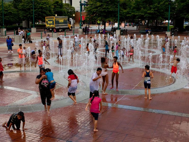 Families Get Wet Playing In Atlanta's Centennial Park Fountain
