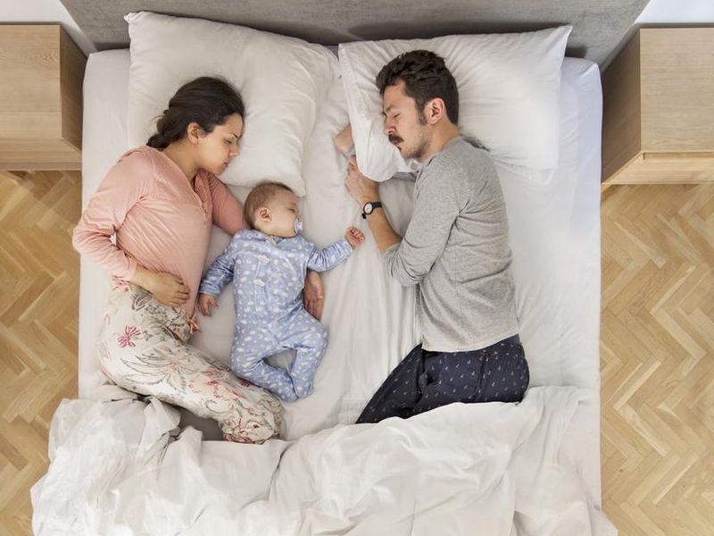 Family in bed sleeping