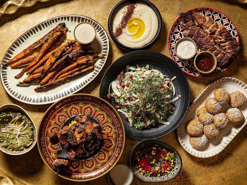 Festive Middle Eastern dishes on table from Maydan, D.C.