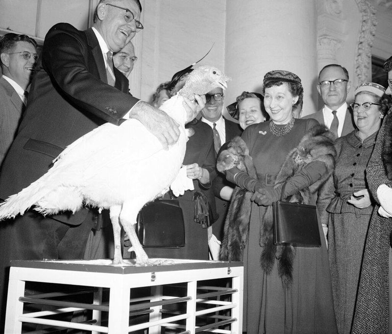 First lady Mamie Eisenhower amused by 40-pound Tom turkey
