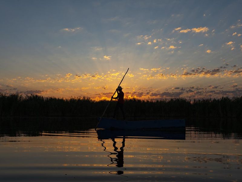 Fisherman silhouette on lake erie