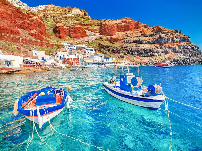 Fishing boats Santorini Greek island in Aegean sea.
