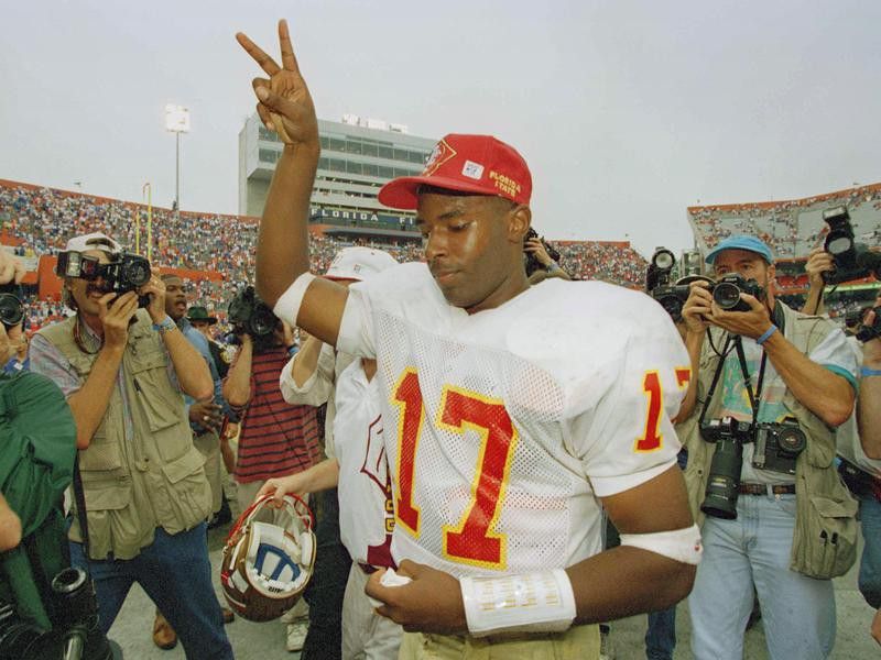 Florida State quarterback Charlie Ward flashes victory sign