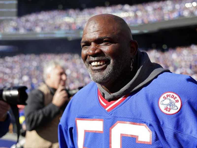 Former New York Giants Lawrence Taylor on the field before an NFL football game against the Indianapolis Colts