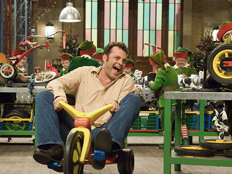 Fred Claus riding around the workshop