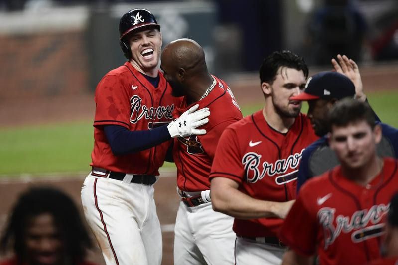 Freddie Freeman of Atlanta Braves celebrates two run home run